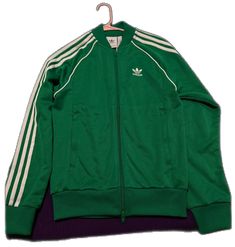 Green Long Sleeve Track Jacket For Winter, Fitted Adidas Track Jacket For Winter, Adidas Track Jacket With Ribbed Cuffs For Spring, Classic Fitted Winter Track Jacket, Adidas Track Jacket With Ribbed Cuffs For Fall, Fitted Green Track Jacket For Winter, Adidas Fitted Track Jacket For Spring, Fitted Green Track Jacket For Streetwear, Adidas Green Track Jacket For Spring