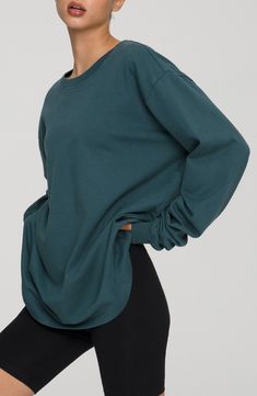 Let yourself lounge in the soft comfort of this oversized long-sleeve T-shirt with slouchy dropped shoulders and cut from breathable cotton. Crewneck Long sleeves 100% cotton Machine wash, tumble dry Imported Women's Clothing Black Owned and Founded Oversized Sporty T-shirt For Fall, Soft-washed Comfy Long Sleeve Tops, Oversized Long Sleeve Athleisure T-shirt, Oversized Solid Activewear For Loungewear, Oversized Activewear For Loungewear, Oversized Cotton Long Sleeve Top For Everyday, Slouchy Long Sleeve Tops For Everyday, Oversized Activewear For Lounging In Fall, Long Sleeve Relaxed Fit T-shirt For Loungewear