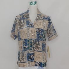 Donnkenny Woman's Blouse Size S Tan Blue Short Sleeve Button Front Shirt Nwt (Ss006) Approximate Measurements: Chest (Armpit To Armpit) 21½” Length (Top Of Collar To Bottom Hem) 27” Sleeve (Shoulder To End Of Sleeve) 10” Made Of 100% Polyester. Made In Vietnam. Please Review The Pictures. Be Sure To Check Out My Closet For Other Great Items. Blue Blouse With Camp Collar And Relaxed Fit, Casual Blouse With Camp Collar And Placket, Blue Blouse With Relaxed Fit And Camp Collar, Blue Short Sleeve Blouse With Placket, Blue Short Sleeve Blouse With Button Closure, Vintage Blue Blouse For The Beach, Vintage Blue Blouse For Beach, Vintage Blue Beach Blouse, Blue Top With Camp Collar And Placket