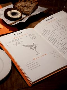 an open book on a table with food