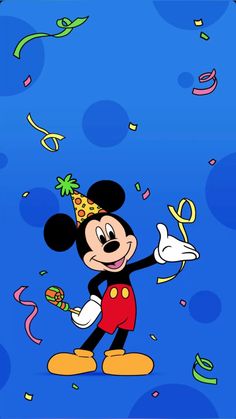 mickey mouse celebrating his birthday with confetti and streamers in the air on a blue background