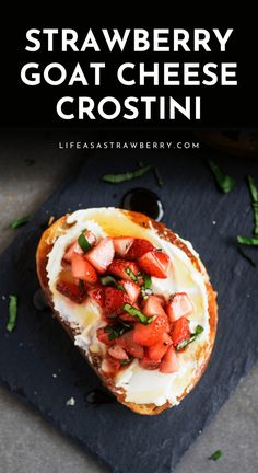 strawberry goat cheese crostini on top of a slate board with text overlay