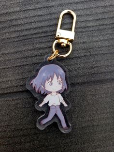 a key chain with an anime character on it