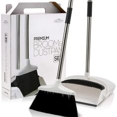 the broom and duster are set up in front of a box with its lid open