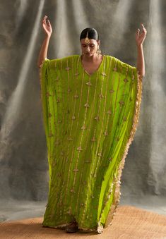 Editor's Note Pure Crepe Floor Length Kaftan With Handmade Lampi Triangles Embroidered All Over As Well As Edged At The Border Fabric: Crepe Color: Olive Green Care: Dry Clean Only About the Designer Itrh makes a high-end luxury Indian ethnic wear made using exquisite and endangered age-old crafts such as kalamkari, madhubani, chikankari, zardozi, and gota weaving. The focus of the house is to cherish the beauty of handcrafted luxury designer wear. Green Kaftan, Kaftan For Women, Kaftan Designs, Parrot Green, فستان سهرة, Stylish Dress Book, Embroidered Clothes, Desi Fashion, Indian Ethnic Wear