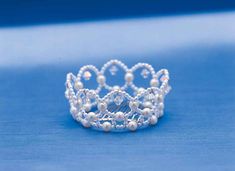 a tiara is shown on a blue surface