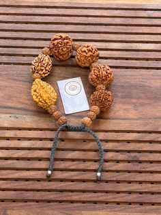 This is a divine bracelet made from natural auspicious beads of 2 - 7 mukhi Rudraksha in black adjustable chord.  This bracelet is adjustable so can fit any wrist size.  This is a healing Shiva bracelet, blessed by priest. The benefits of  2 Mukhi Rudraksha signifies the unity of SHIVA and SHAKTI    We wish you happy wearing and chanting Handmade Spiritual Friendship Bracelets For Festivals, Spiritual Braided Bracelets With Round Beads For Meditation, Adjustable Traditional Bracelets For Rituals, Spiritual Brown Bracelet For Festivals, Spiritual Brown Bracelets For Festivals, Spiritual Brown Bracelet For Rituals, Spiritual Hand-strung Beaded Bracelets For Rituals, Handmade Spiritual Wristband Bracelet, Handmade Spiritual Braided Bracelets