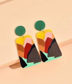 A very light weight and vibrant trapezoid drop Earrings, perfect for any season. They will complement any outfit and the color block detail is beautiful Color Block Accessories, Trendy Geometric Green Jewelry, Trendy Green Geometric Jewelry, Modern Green Geometric Earrings, Modern Multicolor Earrings With Bold Design, Artsy Multicolor Rectangular Earrings, Multicolor Rectangular Jewelry For Summer, Multicolor Rectangular Earrings For Party, Extra Long Earrings