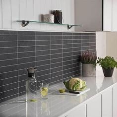 the kitchen counter is clean and ready to be used as a cooking surface for cutting vegetables