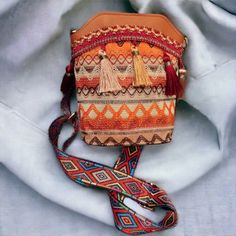 This Bohemian Crossbody Bag Is Perfect For The Free-Spirited Woman Who Wants To Add Some Style To Her Wardrobe. The Bag Features Tassels And A Woven Design In A Brown Color With Multicolored Accents. Its Exterior Is Made Of Polyurethane And It Has A Comfortable Shoulder Strap. It's Great For Carrying Your Everyday Essentials And Adding A Pop Of Color To Your Outfit. It's Perfect For Women Who Love The Ethno Style And Want To Make A Statement With Their Accessories. Ethno Style, Louis Vuitton Neverfull Monogram, Monogram Neverfull, Neverfull Mm Monogram, Louis Vuitton Neverfull Mm, Lv Monogram, Crossbody Messenger Bag, Woven Design, Mini Crossbody Bag