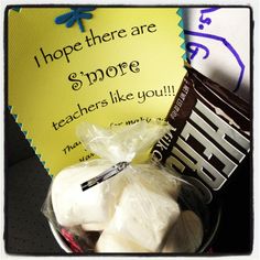 a bowl filled with marshmallows next to a sign that says, i hope there are s'more teachers like you