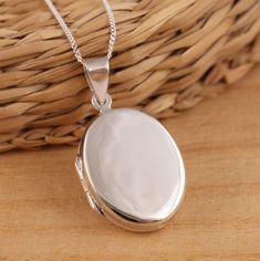 This is solid 925 sterling silver oval shape photo picture locket pendant. 925 stamped.   The locket is plain highly polished on both sides. Approx. pendant measures:             total length: 35mm            without bail: 27mm            width: 19mm       Approx. pendant only weight : 5.2gr.  Available on its own or with various length  (16-30Inch ) 1mm curb chain, please choose from the drop down menu at the top of the page. Presented in gift box.  Thank you for looking! Oval Sterling Silver Locket Necklace, White Gold Sterling Silver Oval Pendant Locket Necklace, Silver Locket Necklace With Polished Oval Pendant, Silver Oval Link Locket Necklace Gift, Oval Sterling Silver Locket Necklace Gift, Classic Sterling Silver Oval Locket Necklace, Silver Oval Pendant Locket Necklace With Polished Finish, White Gold Oval Pendant Locket Necklace, Sterling Silver Locket Necklace With Oval Link For Gifts