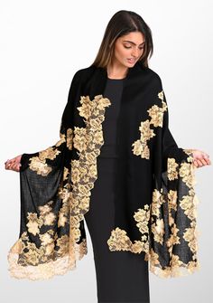 Shop this black scarf featuring an intricately handcrafted application of an exotic contrasting gold Chantilly lace extending inward in a vine pattern from the ends of the scarf. Order now! Luxury Embroidered Elegant Scarf, Elegant Pashmina Shawl With Intricate Embroidery For Festive Occasions, Elegant Gold Embroidered Dupatta, Elegant Gold Embroidered Dupatta In Traditional Drape, Formal Shawl With Intricate Embroidery, Elegant Formal Shawl With Intricate Embroidery, Elegant Pashmina Dupatta With Intricate Embroidery, Luxury Festive Shawl, Elegant Fall Pashmina Shawl