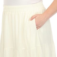 Elevate your fashion game with this flowy and effortlessly chic skirt. This maxi skirt from White Mark boasts a pleated design that adds texture, movement, and a touch of sophistication to your look. Dress it up or down as this skirt is incredibly versatile. Pair it with a tucked in blouse and heels for a sophisticated look or go for a more relaxed vibe with a tucked in tee and sandals and pair it with a jacket on chilly days. It’s perfect for various occasions and style preferences. White Relaxed Pleated Skirt With Elastic Waistband, White Maxi Skirt With Elastic Waistband For Spring, Spring Flowy Cream Maxi Skirt, Flowy Wide Leg White Skirt, Spring Cream Flowy Maxi Skirt, Cream Flowy Maxi Skirt For Spring, White Flowy Tiered Maxi Skirt, Chic Cream Ruffled Maxi Skirt, Elegant White Maxi Skirt With Pleated Hem