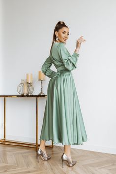 Fabric: faux silk Viscose 35%, Polyester 35%, Cotton 20% Nylon 10% V-neck Long sleeve Puffed sleeve Accordion pleat Maxi length Elegant Billowy V-neck Maxi Dress, Elegant Green V-neck Long Sleeve Dress, Spring Formal Ruched V-neck Dress, V-neck Dress With Gathered Sleeves For Fall, Fall V-neck Dress With Gathered Sleeves, Silk V-neck Dress With Gathered Sleeves, Silk Pleated V-neck Maxi Dress, Elegant Long Sleeve Midi Dress With Folds, Elegant V-neck Pleated Dress For Fall