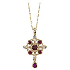 This beautiful pendant features gorgeous red rubies and sparkling white diamonds, set in an original, elegant design. Handcrafted in 18k yellow gold by our Master Jewelers in Los Angeles, this piece has a Renaissance style and timeless feel. The high level of craftsmanship displayed by this intricately rendered piece is seldom seen today. One-of-a-kind! 18k yellow gold chain included. 18k yellow gold chain measures 18 inches in length Rubies weigh 1.86 carat total Diamonds weigh .26 carat total Ruby Diamond Pendant, Ruby And Diamond Necklace, Chic Necklace, Gold Cross Necklace, Gold Diamond Necklace, Antique Necklace, Yellow Gold Chain, Gold Chain Necklace, Dream Jewelry