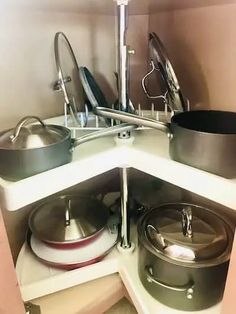 a kitchen with pots and pans in the corner