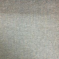 an upholstered gray fabric textured with small squares