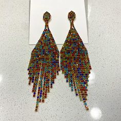 Multicolor Drop Earring Eye-catching Multicolor Jewelry For Party, Rainbow Drop Earrings For Party, Multicolor Crystal Earrings For Party, Eye-catching Dangle Earrings For Party, Multicolor Crystal Earrings For Evening, Multicolor Chandelier Drop Earrings For Party, Eye-catching Multicolor Party Jewelry, Multicolor Dangle Earrings For Party, Multicolor Crystal Matching Earrings For Party