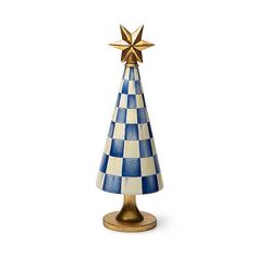 a blue and white ceramic christmas tree with a gold star on it's top