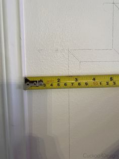 a measuring tape is hanging on the wall