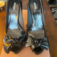 Gorgeous Gunmetal (Vernice Metal Grafite) 4” Heel Patent Leather Open Toes With Bow Detail..Brushed Chrome Detail On Heel So Sexy!! Excellent Condition As Worn Only Once J Make Me An Offer!!! Metallic Patent Leather Heels With Round Toe, Metallic Round Toe Patent Leather Heels, Miu Miu Luxury Heels With Sculpted Heel, Luxury Miu Miu Heels With Sculpted Heel, Miu Miu Heels With Branded Heel Counter For Evening, Luxury Patent Leather Miu Miu Heels, Miu Miu Luxury Patent Leather Heels, Luxury Miu Miu Patent Leather Heels, Miu Miu Heels With Sculpted Heel For Evening