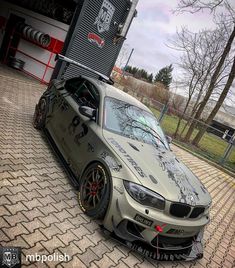 a car parked in front of a garage