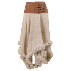 Vintage Alexander McQueen cream wool knit skirt featuring attached cognac brown leather belt with four buckles, oversized pom-poms at hem, and asymmetrical hemline. Collection 2003. Excellent Vintage Condition Size 42 Vintage Alexander Mcqueen, Alexander Mcqueen Skirt, Ski Chic, 2000s Skirt, Fashion Illustration Face, Festival Fits, Couture Skirts, Unique Skirts, Alexander Mcqueen Clothing