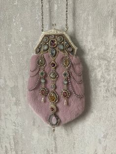 "Laleli" means "with tulips" which are main motives in this unique powder pink color natural mink fur bag, shimmered in crystals and pearls. It's remind us of tulip motives so richly used in eastern miniature paintings. A beautiful piece that can become a wedding or special occasion accessory and then could be family heirloom for next generations.  Very delicate dimensions in wide - 12 cm in widest part of purse frame and 16cm in widest part of bag and 27 cm long. Although is still very comfortable for all your accessories, including modern phones. Chain handle - total 48 cm length. Front size are richly decorated with embroidery and beaded pendants, backside are more moderate with different design of two tulips of pearl and seed bead. Bag has been made of best Austrian crystals and pearls Luxury Pink Evening Bag For Wedding, Luxury Pink Handheld Evening Bag, Elegant Pink Embellished Evening Bag, Luxury Pink Bags For Wedding, Luxury Pink Bags For Events, Designer Pink Embellished Bags, Designer Pink Evening Bag, Pink Embellished Evening Bag, Luxury Pink Wedding Bags