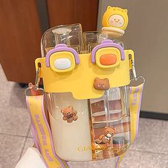 a yellow and purple bag with some items in it