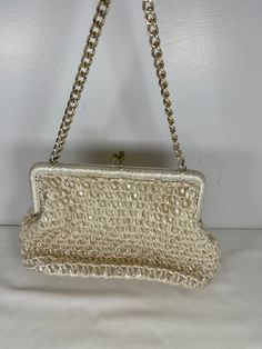 Please read full description below and see all photos! Fantastic, Mid Century 1960's Cream/off white raffia and bead sweet evening purse with metal chain strap and kiss-lock.  Super cute and in excellent condition! Made in Japan (with tag inside) and lined - the lining has a few age spots.   Outside is in excellent condition - no holes or tears or stains. 6" tall 8.5" long 2" deep Please convo me for more information or photos! Please like my shop for all the latest vintage finds!  I post often! Vintage Party Clutch With Pearl Handle, Cream Woven Evening Bag, Vintage Formal Clutch With Pearl Handle, Vintage Pearl Handle Clutch Evening Bag, Vintage Evening Clutch With Pearl Handle, Retro Beige Bag For Party, Retro Beige Party Bag, Vintage Beige Evening Bag With Pearl Handle, Vintage Clutch Evening Bag With Chain Strap