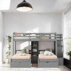 two bunk beds in a room with white walls