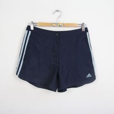 Cool training shorts in size M (40 women's size) from Adidas. Waist size is approx. 36 cm and stretchy and length approx. 31 cm. Has a button and two closable front pockets. Without inner lining or inner pants. 100% polyester. You can find more sports pants and other vintage clothes in our Etsy shop. If you have any questions, just write to us! Your Soul&Style from Berlin P.S.: Our clothes are vintage, so not new. We list defects that go beyond expected signs of wear (e.g. stains, missing button 90s Sport, Sports Pants, Training Shorts, Vintage Clothes, Sport Pants, Sport Shorts, Swim Trunks, Swim Shorts, Waist Size