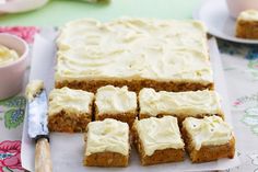 carrot cake with cream cheese frosting cut into squares