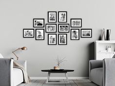 a living room filled with furniture and framed pictures on the wall above a coffee table