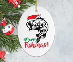 a christmas ornament with a fish on the front and merry fishing written on it