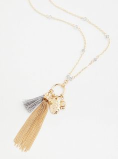 Bump up the flirt and flair in your outfits with this gold-tone charm tassel necklace. 30” length + 3” extender. Lobster clasp. Man-made materials. Imported. The best plus size women's gold-tone charm tassel necklace necklaces in gold. Torrid is your destination for the freshest spring and summer styles. Gold Tassel Necklace With Adjustable Chain, Chic Gold Tassel Necklace For Gifts, Gold Metal Dangle Tassel Necklace, Gold Metal Tassel Dangle Necklace, Gold Tassel Dangle Necklace, Gold Long Tassel Necklace With Adjustable Fit, Gold Long Tassel Necklace, Gold Long Necklace With Tassels, Gold Lariat Tassel Necklace