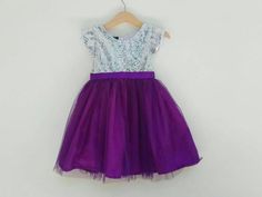 Silver and purple flower girl dress. The top is silver sequin with short sleeve and the bottom is purple glittered tutu with matching satin ribbon belt.Perfect for flower girl dresses in purple wedding theme.The tutu used here is purple number 45I also can do another color as in the last picture, just leave me a note at the 'message to seller' box when check out or do not hesitate to contact me to inquiry.Custom Order Size: Please provide your child measurement: Chest and specific length otherwi Purple Tulle Skirt, Purple Tutu Dress, Purple Flower Girls, Purple Flower Girl Dress, Purple Girls Dress, Purple Tutu, Purple Wedding Theme, Wedding Purple, Silver Sequin Dress