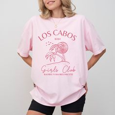 "Cabo Bachelorette Shirts Personalized Beach Bachelorette Party Shirts Charleston Bachelorette Tee Bridesmaid Shirt Custom Bridal Party Gifts Premium Quality Printed in the USA. HOW TO ORDER ----------------------- 1-) Check and Review all Photos. 2-) Select Your T-Shirt Size from drop down menu. 3-) Choose Your Quantity you want. 4-) Click ADD TO CART. And, you can go back to add more product for your family members or You can complete the checkout process. 5-) Please Click \"Proceed to Check Out\" 6-) Your order will be ready to ship 2-5 Business Day. ABOUT US --------------- We are a husband-and-wife team who believe that beauty is all around us, and we strive to capture it in our designs. Thank you for choosing to shop with us, and we hope you find something that inspires you! For cust Pink Tops For Bachelorette Party, Summer Crew Neck Tops For Bachelorette Party, Pink Crew Neck T-shirt For Bachelorette Party, Crew Neck Tops For Bachelorette Party In Summer, Pink Short Sleeve Shirt For Bachelorette Party, Summer Bachelorette Party Shirt With Graphic Print, Summer Bachelorette Party Crew Neck Shirt, Summer Graphic Print Shirt For Bachelorette Party, Graphic Print Shirt For Summer Bachelorette Party