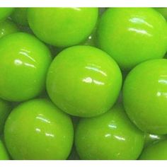 a pile of green apples sitting next to each other