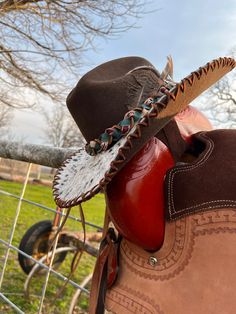 Wanting to add a little something on your hat?!?  This is the place for you! I can put hair on hide onto the brim of your hat, Just like the one in the pictures. And they're all uniquely different because the leather isn't all the same.   we will supply the hat, just send us your hat size , color and style.  pricing veries on what hat you pick  $190 and so on  can get better shipping prices than Etsy.  Done in the USA Custom Brown Hat Bands For Ranch, Custom Brown Felt Hat For Ranch, Artisan Leather Hat Bands For Rodeo, Artisan Leather Hat For Rodeo, Custom Brown Felt Hat For Western-themed Events, Handmade Western Felt Hat For Ranch, Western Handmade Felt Hat For Ranch, Artisan Leather Hat Bands For Western-themed Events, Artisan Leather Hat For Western-themed Events