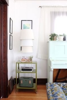 a living room with a couch, table and lamp