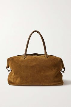 Métier's weekend bags will add a touch of sophistication to your next getaway. Handmade in Italy plush tan suede, this 'Perriand' tote has ample space inside to carry all your essentials, including a cosmetics case and spare shoes. It has braided leather-trimmed top handles that are robust enough to withstand heavy loads and feet to protect the base. Cool Tote Bags, Weekend Bags, Leather Weekender Bag, Suede Bag, Suede Tote, Suede Handbags, Stylish Handbags, Big Bags, Weekender Tote