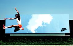 a man is jumping in the air on a billboard