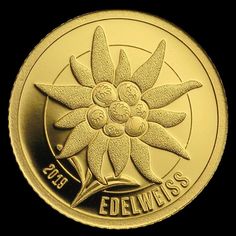 a gold coin with an image of a flower on it