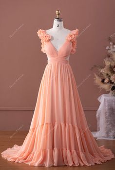 This captivating peach pink chiffon formal dress takes exquisite charm to the next level. #V-neck #peachdress #chiffondress #promdress #formaldress #longdress Pink Peach Dress, Peach Dress Outfit Wedding, Peach Dress Outfit, Peach Formal Dress, Peach Tulle Dress, Botas Outfit, Pastel Prom Dress, Peach Prom Dresses, Chiffon Formal Dress