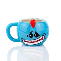 a blue coffee cup with a face painted on the front and sides, sitting on a white surface