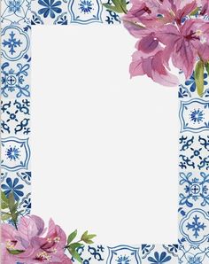 a blue and white plate with pink flowers on the edge, in front of a floral border