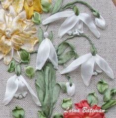 a close up of some flowers on a piece of cloth