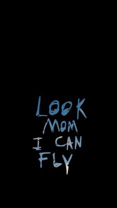 a black background with the words look mom, i can fly written in white chalk